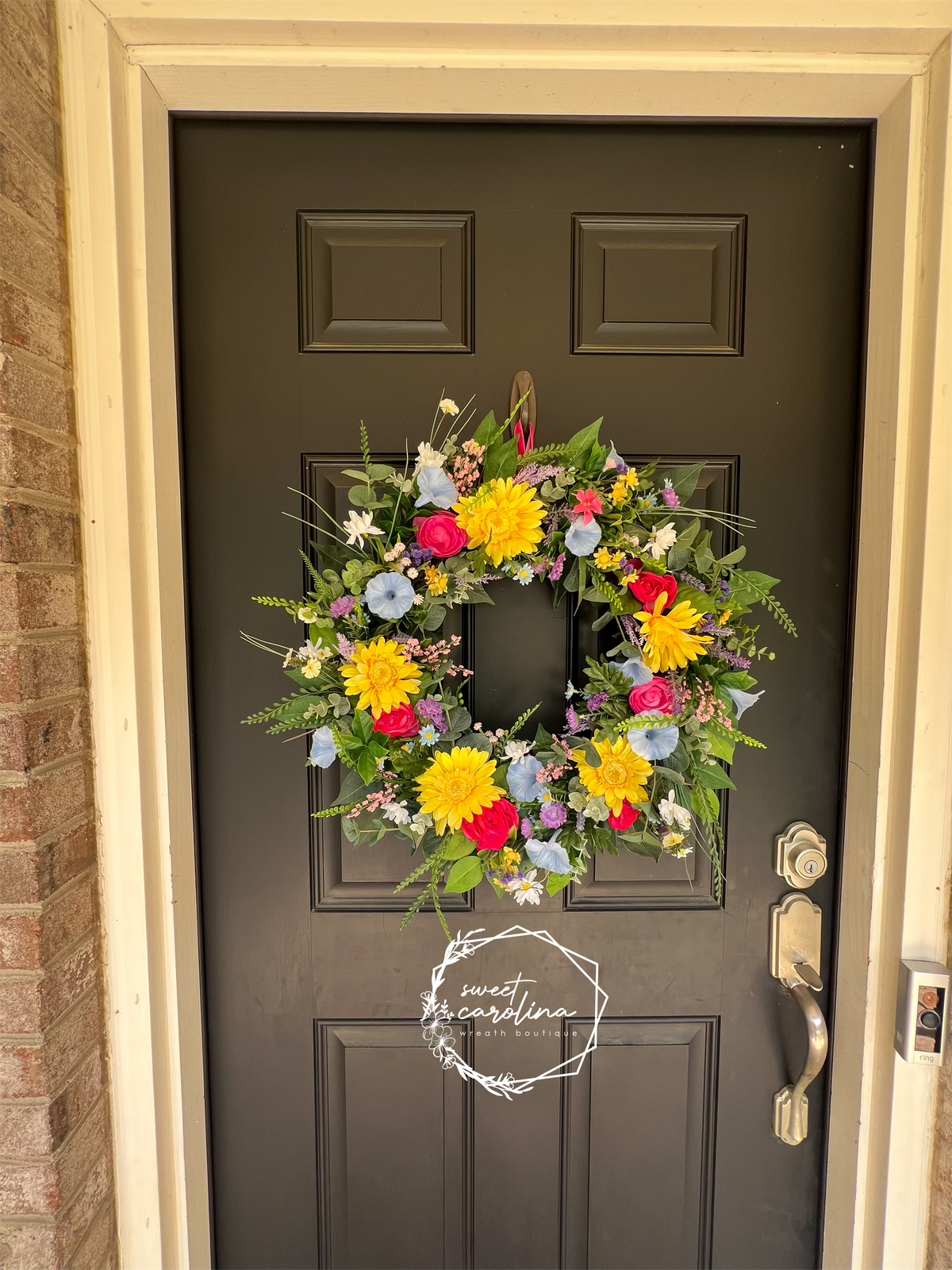 Bright Spring Wreath with daisies, petunias, and ranunculus