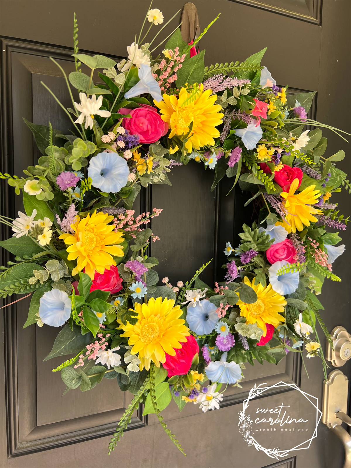 Bright Spring Wreath with daisies, petunias, and ranunculus