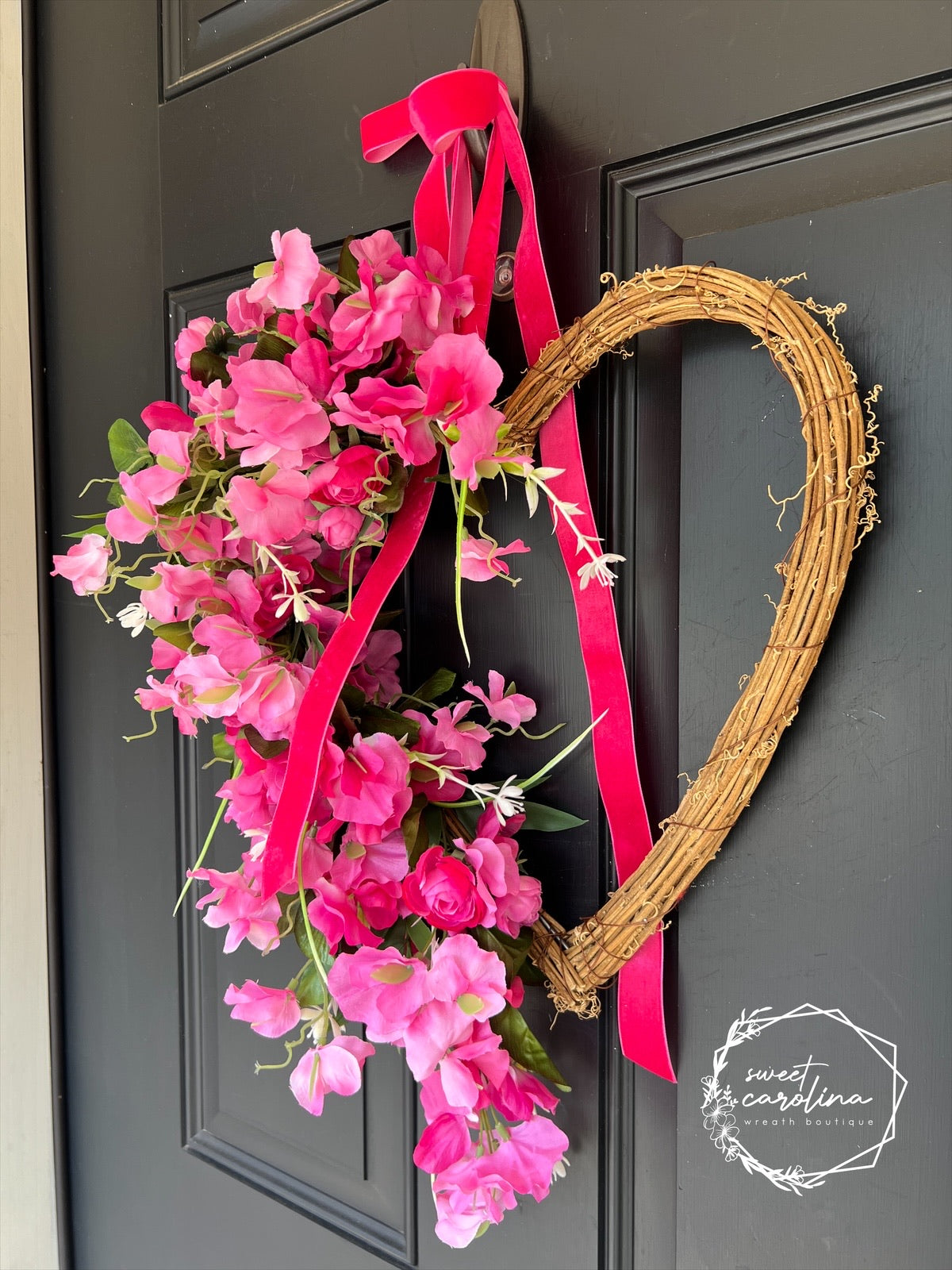 Hot Pink Sweet Pea and Ranunculus Draped Heart Vine Wreath with Velvet Bow