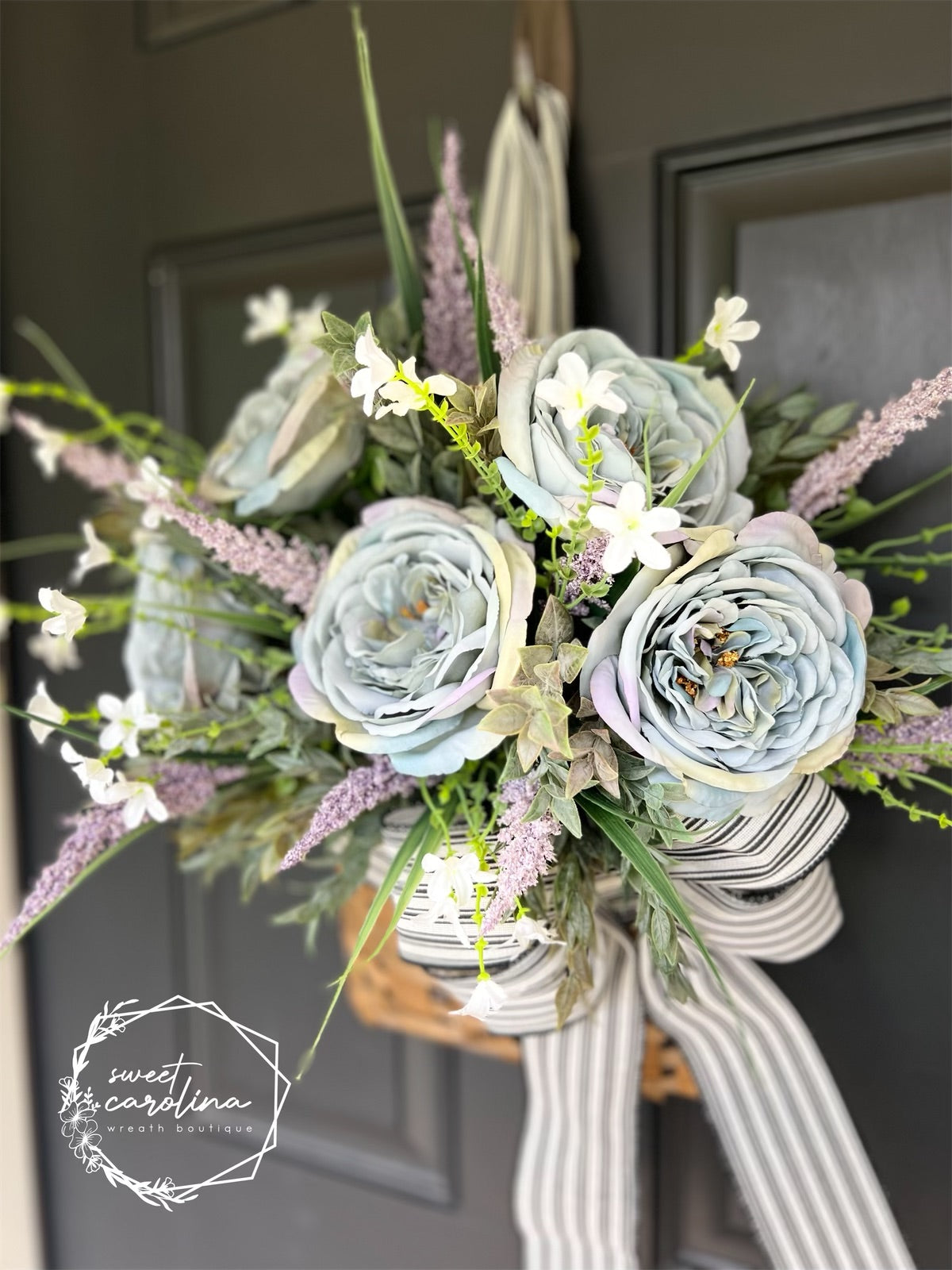 Muted tones of Grey and Lavender with Roses and Ruscus