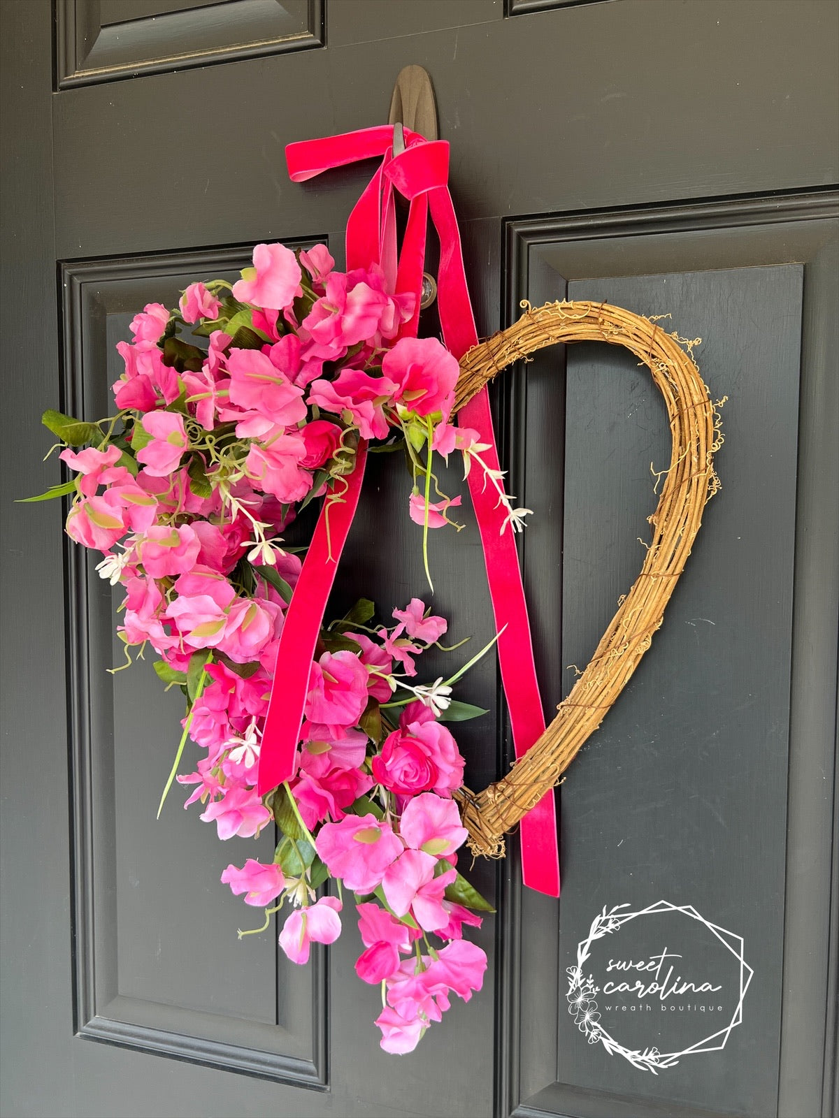 Hot Pink Sweet Pea and Ranunculus Draped Heart Vine Wreath with Velvet Bow